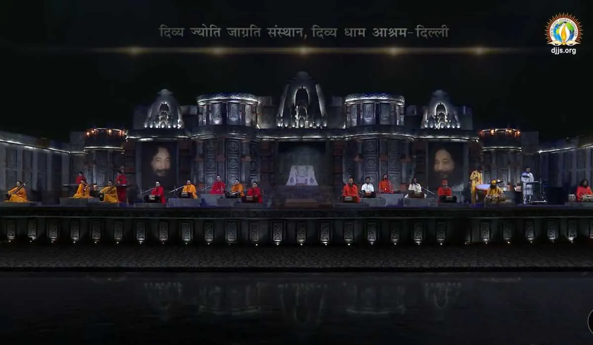 A temple-like stage set at night for a monthly spiritual congregation at Divya Dham Ashram, February 2022